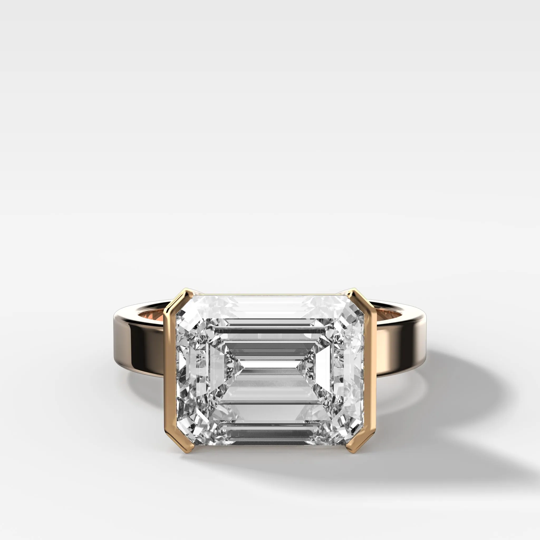 Finest Half Bezel Solitaire Engagement Ring With East West Emerald Cut Diamond