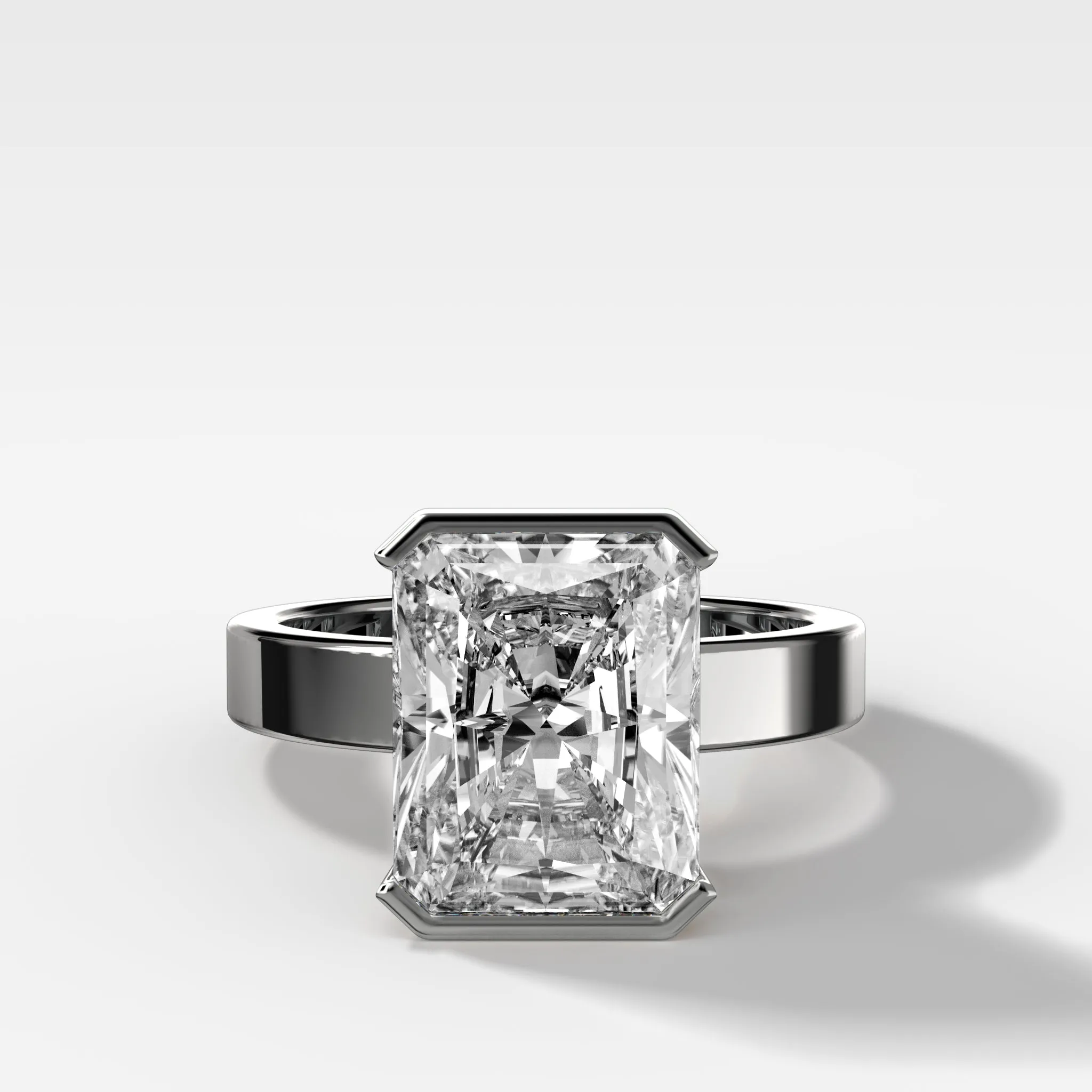 Finest Half Bezel Solitaire Engagement Ring With Elongated Radiant Cut Diamond